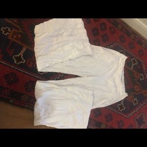 White flowing pants. Flare bottom. Side zipper